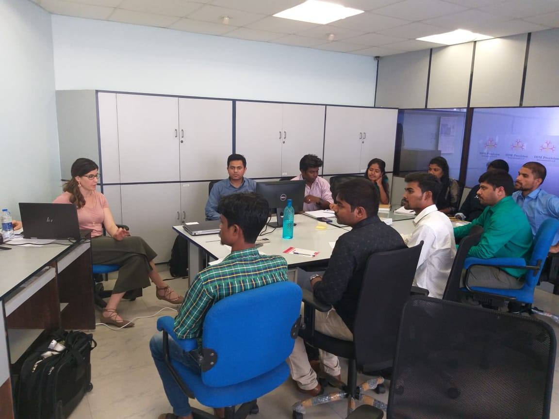 Logan leading a working session with a healthcare team